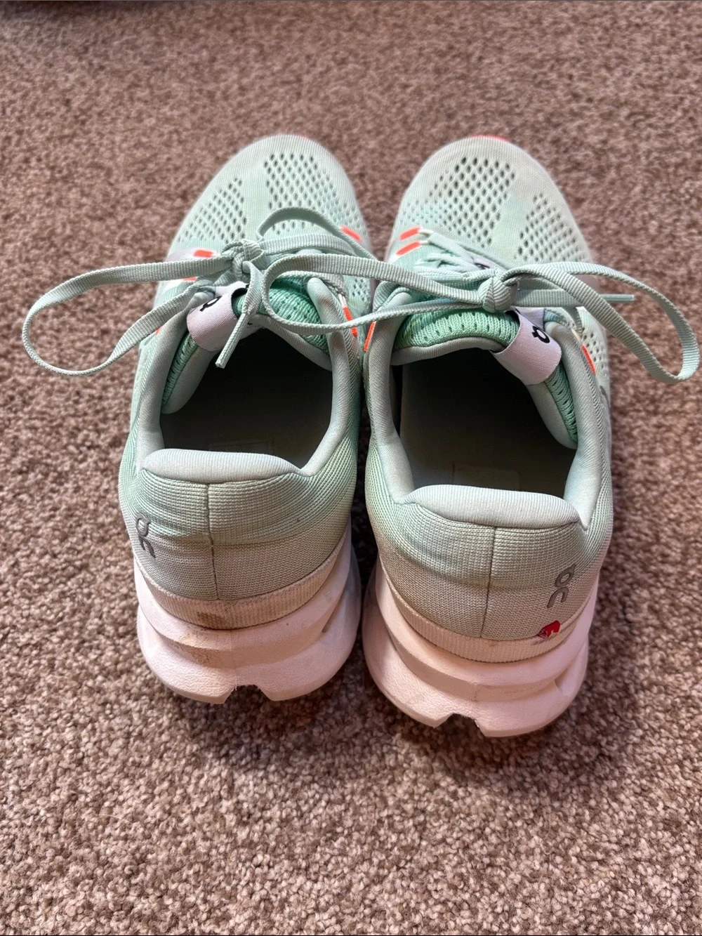 On Running Sneakers in Mint Green with Orange Accents